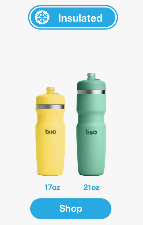 Two Bivo insulated water bottles shown on a light gray background, one corn color and one aqua, with sizes 17oz and 21oz. Shop Bivo Insulated Cycling Bottles