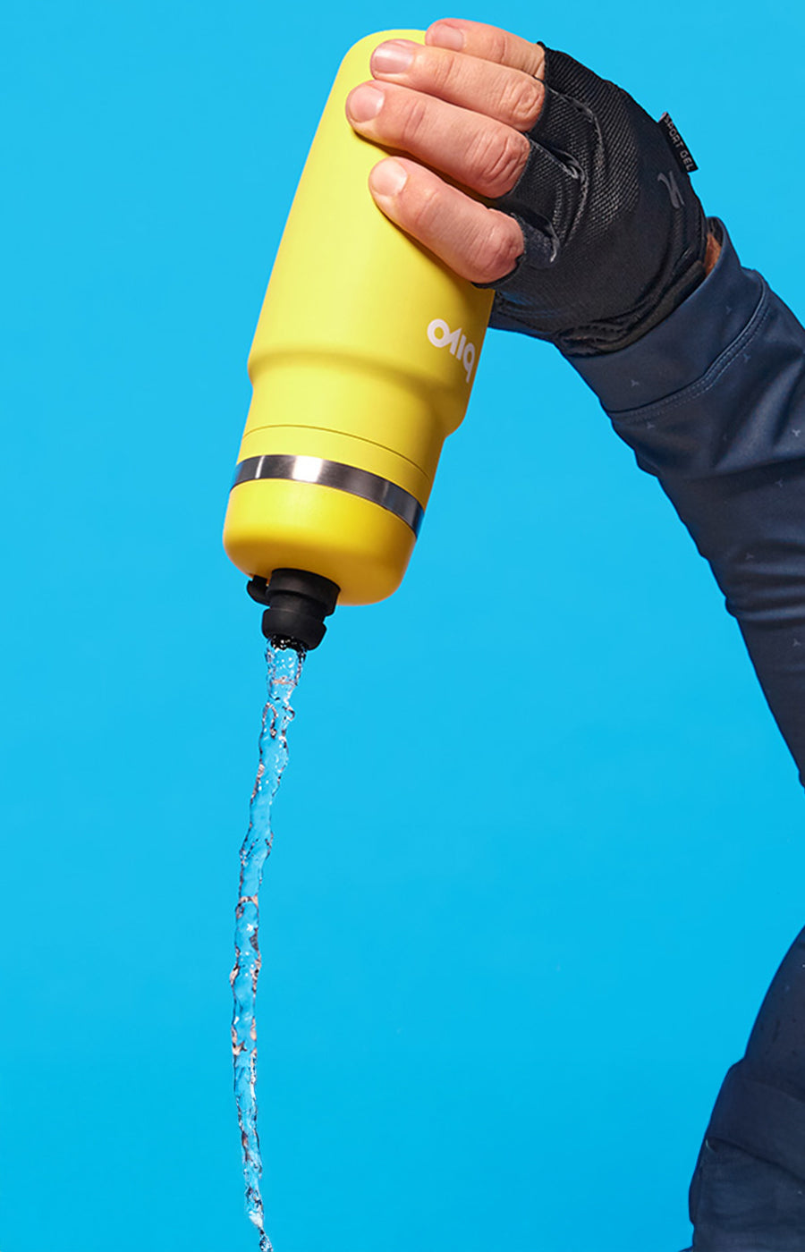 Sun colored Bivo water bottle being used with a blue background.