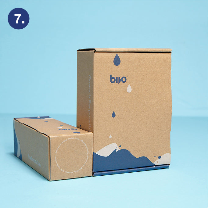 Two cardboard boxes with 'Bivo' branding on a blue background